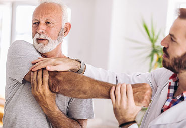 Senior man getting a chiropractic adjustment