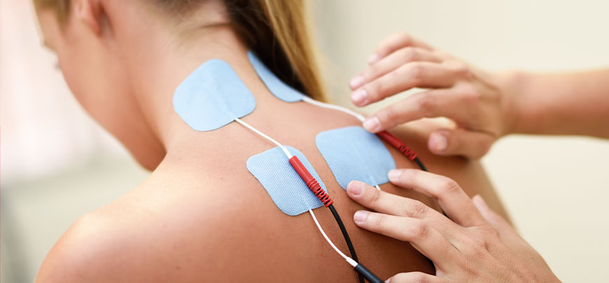 Female patient recieving Microcurrent for neck pain relief