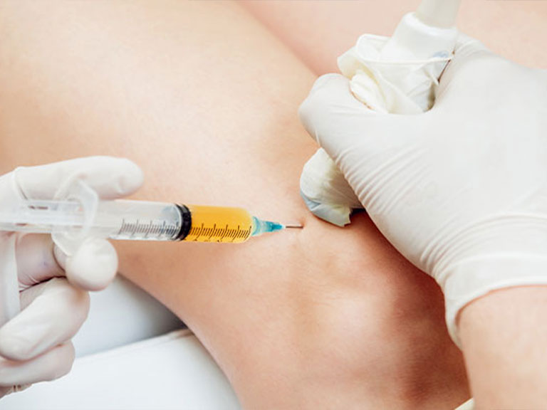 Patient recieving Hyaluronic Acid Injections at Advanced Health & Wellness Center in Wadsworth for knee pain relief