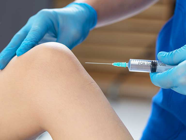 Patient recieving Ozone Therapy at Advanced Health & Wellness Center in Wadsworth for knee pain relief