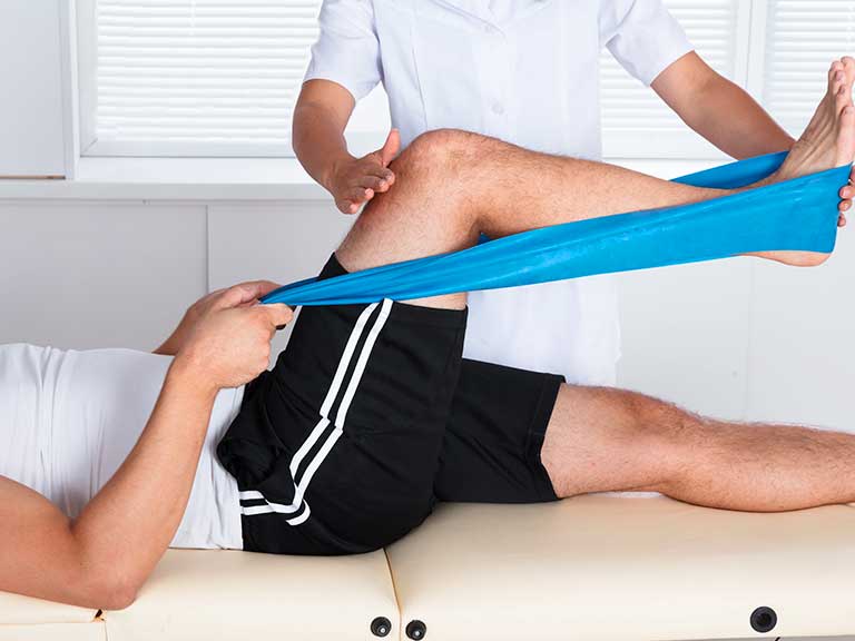 Patient recieving Rehabilitative Therapy at Advanced Health & Wellness Center in Wadsworth for knee pain relief