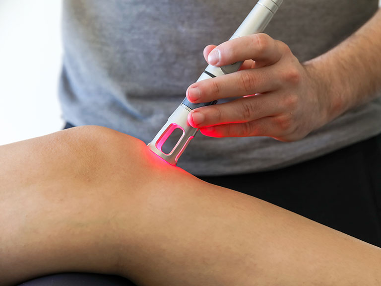 Patient recieving Class IV Laser Therapy at Advanced Health & Wellness Center in Wadsworth for knee pain relief